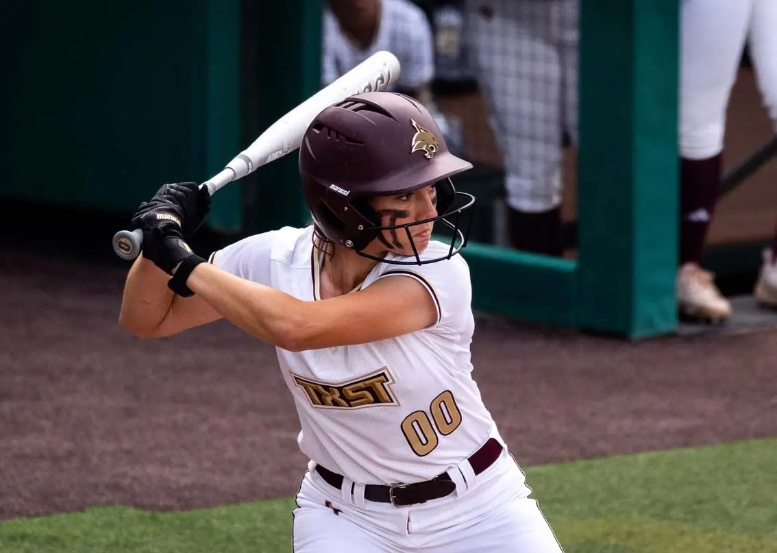 Softball player getting ready to bat